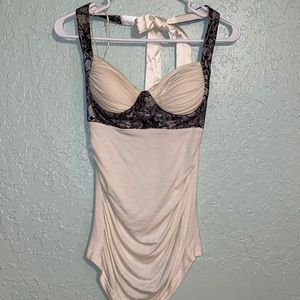 Small Charlotte Russe ivory halter top with black lace detail $12